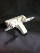 A 4-inch cream-colored bath sink lever faucet with a plastic body and stems, featuring a lever handle.