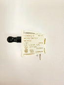 A black door switch labeled 'Miller 304629 MICRO SWITCH' with a manufacturing code and voltage information printed on a white label.