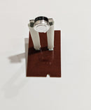A brown high limit switch with metal components and wiring terminals.
