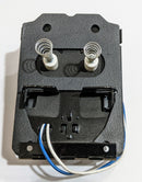 A Beckett electronic igniter for oil furnaces, with a black plastic housing and a red label warning about hazardous voltage.