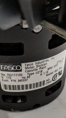 Close up of the label on the Inducer fan assembly for a mobile home heating system with visible gasket, electrical wiring, and a black plastic housing.