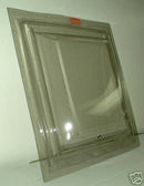 A double pane skylight with a green tint and metal flanges, designed for mobile home installation.