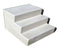 A set of white fiberglass outdoor steps with a textured, slip-resistant surface.